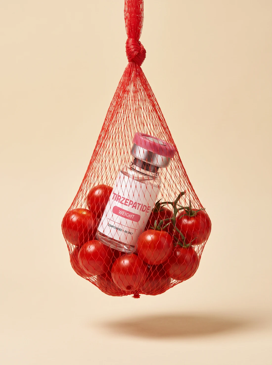 Compounded Tirzepatide vial and tomatoes in a red net bag